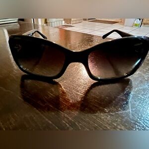 Women’s Tory Burch sunglasses.